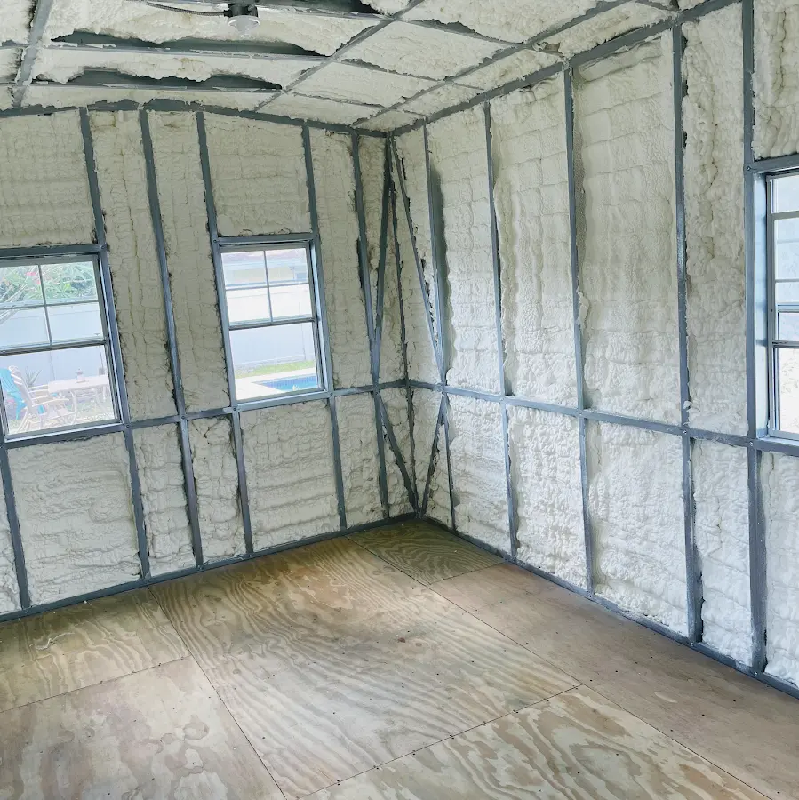 Closed-cell spray foam insulation applied to wall cavities in a residential project in East Troy